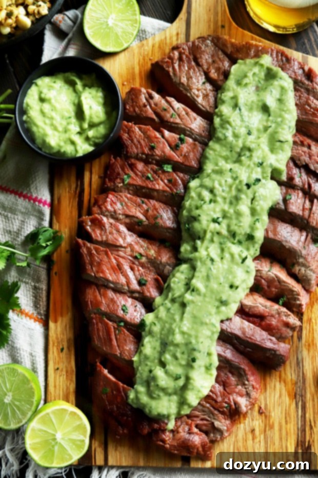 Smoky Citrus Flank Steak with Cool Avocado Crema 11 Chipotle lime flank steak on a cutting board