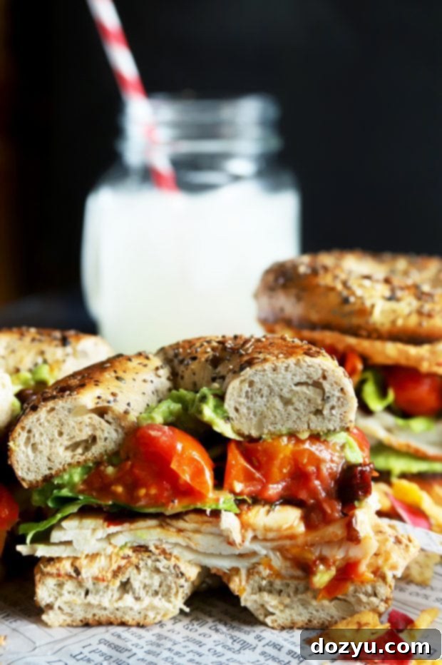 Everything Avocado Turkey Bagel Sandwich 8 Half of a vegetable bagel sandwich