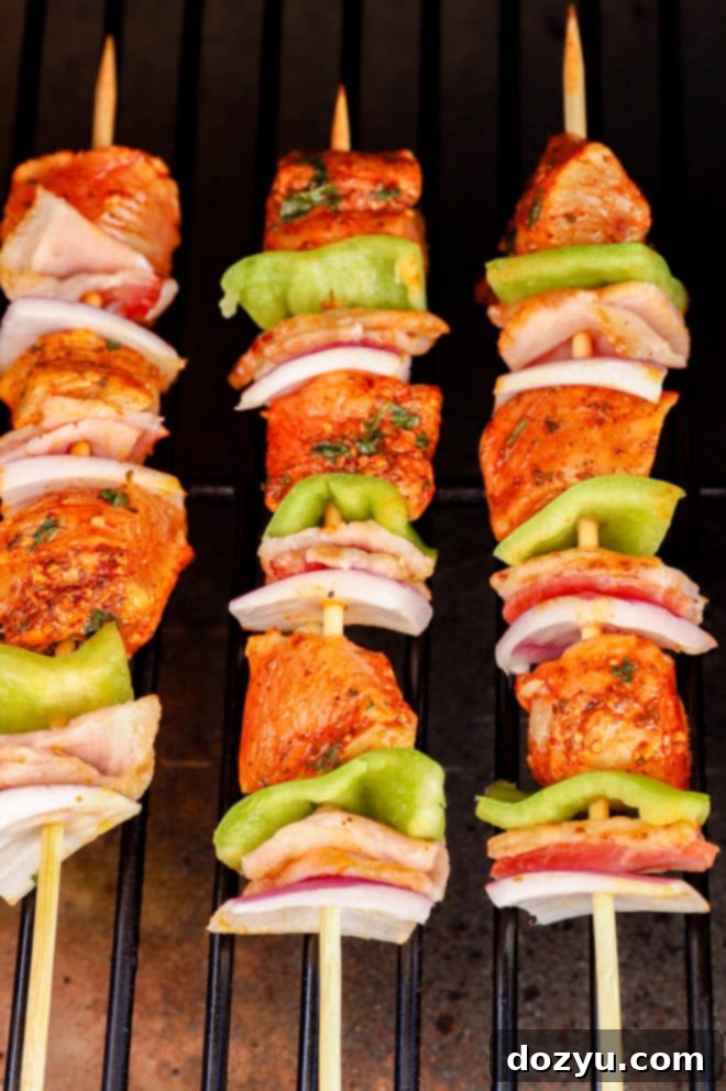 Smoky Chipotle Grilled Chicken Skewers 5 grilled bbq chicken skewers on the grill