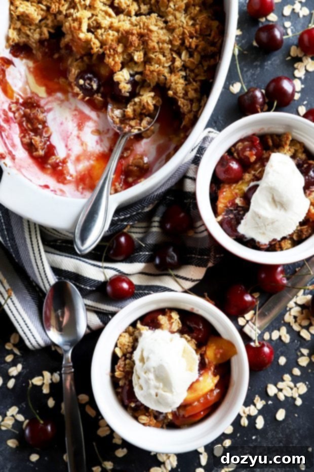 Sweet & Boozy Bourbon Cherry Peach Crumble 2 Bowls of summer fruit crumble and ice cream