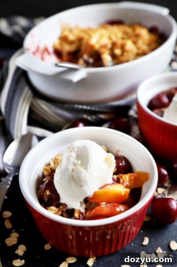 Sweet & Boozy Bourbon Cherry Peach Crumble 9 Individual cherry peach crumble desserts with ice cream