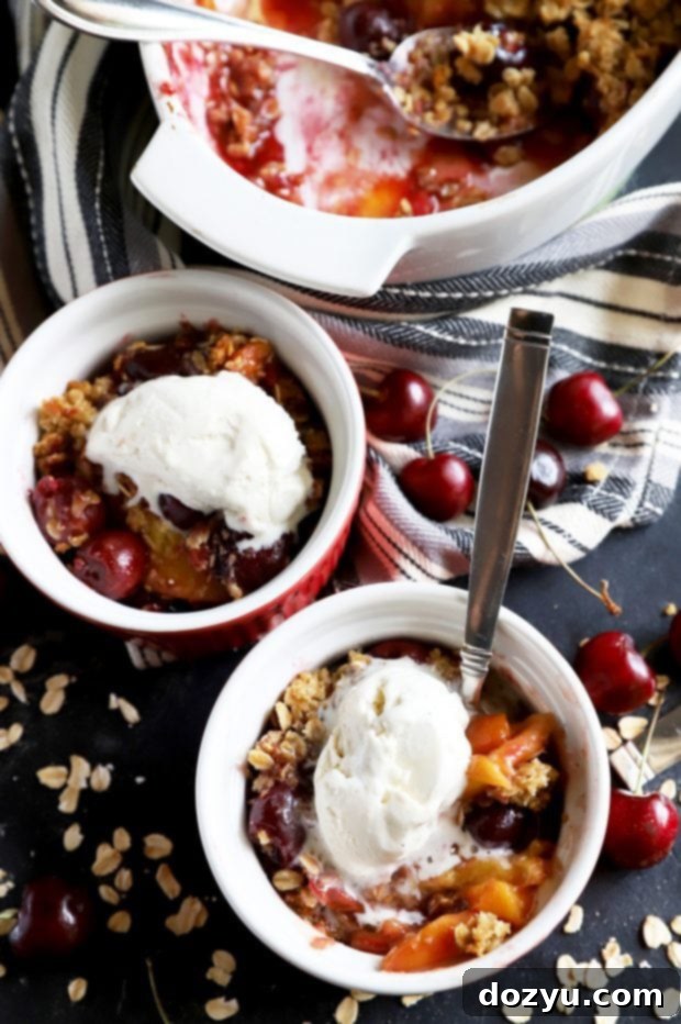 Sweet & Boozy Bourbon Cherry Peach Crumble 10 Small bowls of fruit crumble with ice cream