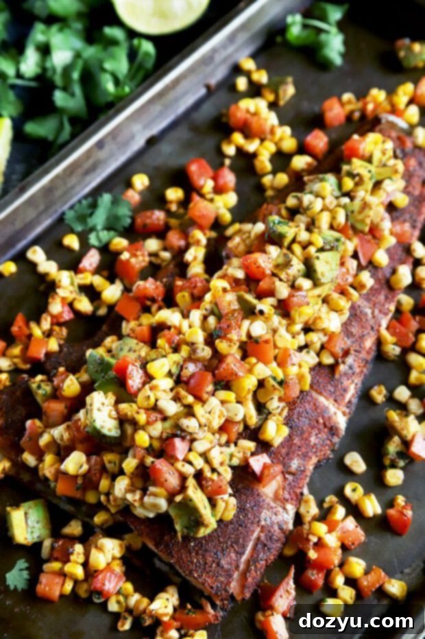 Pan-Seared Salmon with Charred Corn, Avocado and Tomato Salsa 2 Whole grilled salmon filet with spice rub, garnished with lime wedges