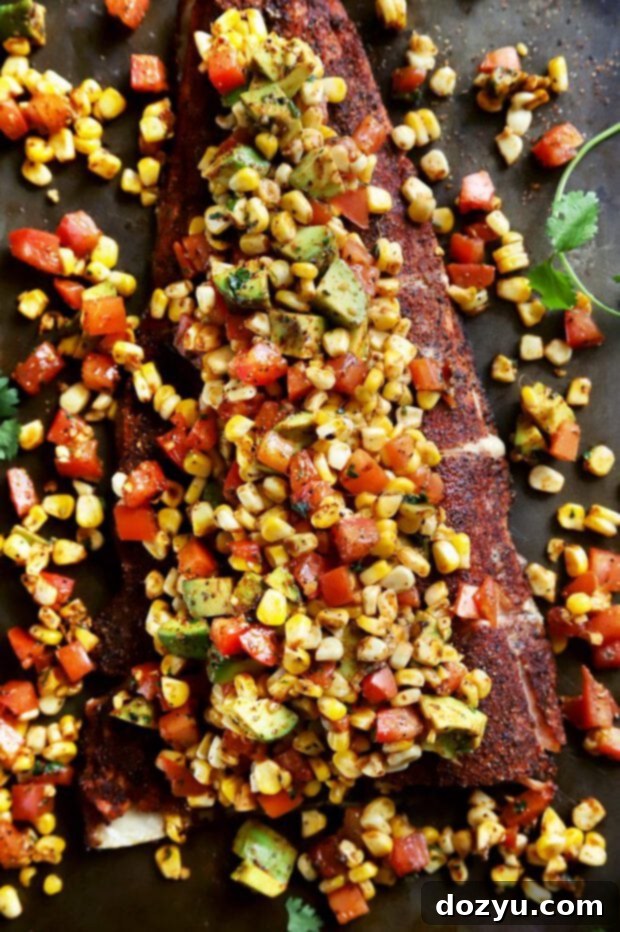 Pan-Seared Salmon with Charred Corn, Avocado and Tomato Salsa 7 Overhead shot of grilled salmon with vibrant charred corn avocado tomato salsa