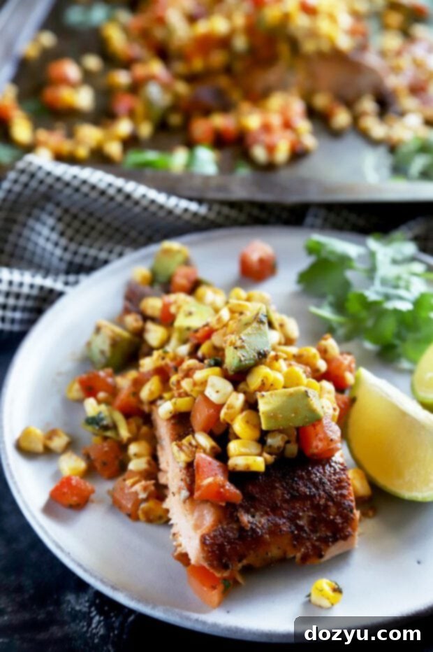 Pan-Seared Salmon with Charred Corn, Avocado and Tomato Salsa 8 Close-up of vibrant corn avocado tomato salsa resting on a grilled salmon fillet