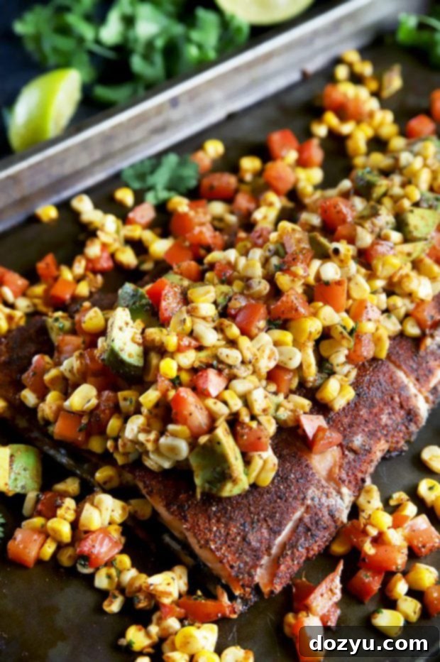 Pan-Seared Salmon with Charred Corn, Avocado and Tomato Salsa 9 Side photograph of grilled salmon with spice rub and fresh charred corn avocado tomato salsa