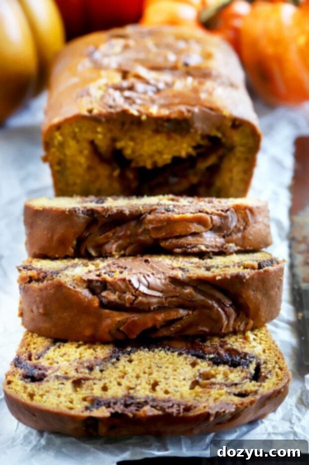 Decadent Pumpkin Banana Bread with Nutella Swirl 6 Sliced pumpkin banana bread with nutella swirl