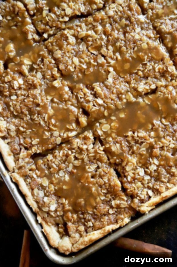 A freshly baked caramel apple slab pie, cut into neat squares, ready to be served from the pan.