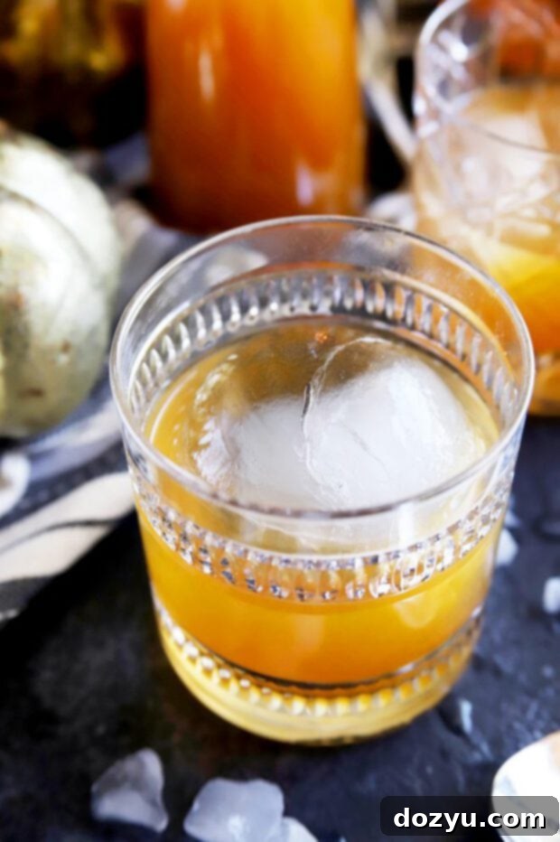 Autumn Ember Old Fashioned 5 Single Pumpkin Spice Bourbon Old Fashioned cocktail garnished with an orange peel