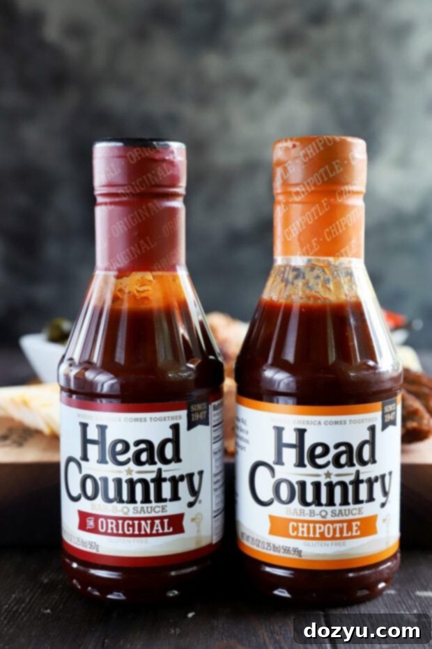 Several bottles of Head Country Bar-B-Q sauce lined up