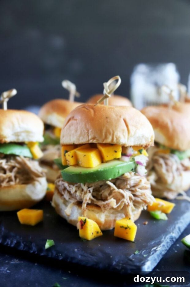 Tropical Jerk Chicken Sliders with Zesty Mango Salsa 2 Jerk chicken sliders with mango salsa and avocado