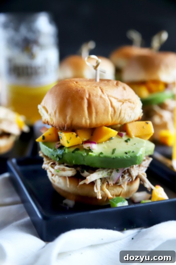 Tropical Jerk Chicken Sliders with Zesty Mango Salsa 10 Toasted slider buns with chicken and salsa