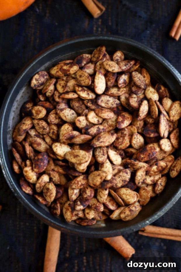 A beautifully arranged bowl overflowing with perfectly roasted pumpkin seeds, ready for serving and enjoying as a delightful snack.