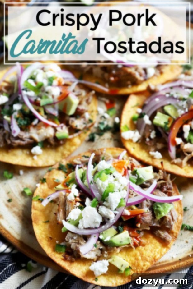 Pinterest image for Crispy Instant Pot Carnitas Tostadas, featuring a beautifully plated tostada.
