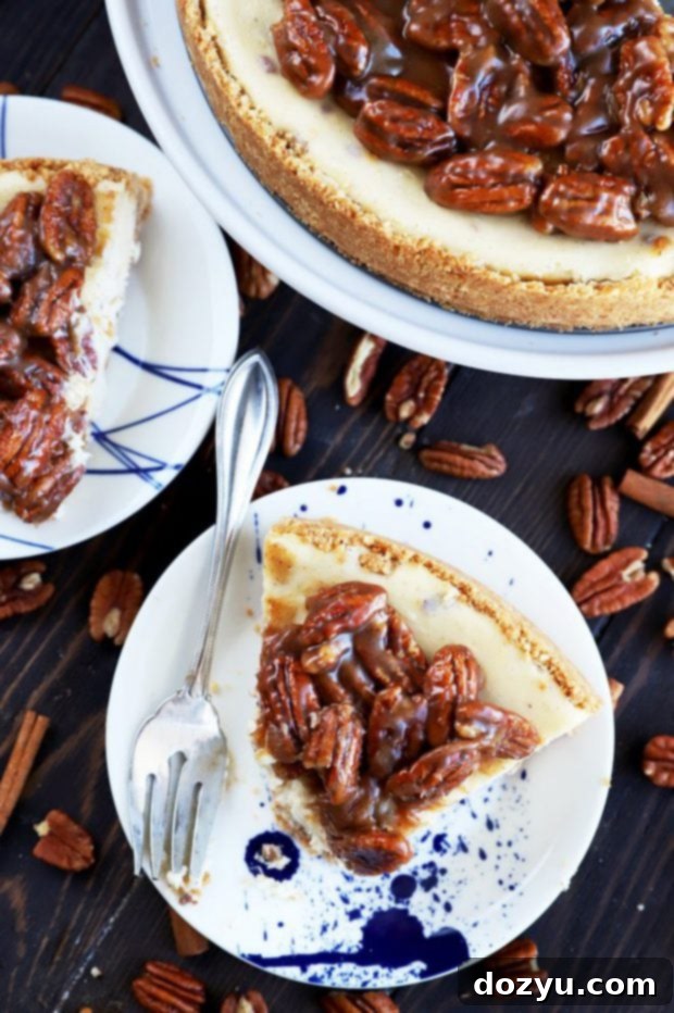 Decadent Pecan Pie Cheesecake 8 A slice of pecan pie cheesecake with a bite taken out, showing its creamy texture and pecan topping