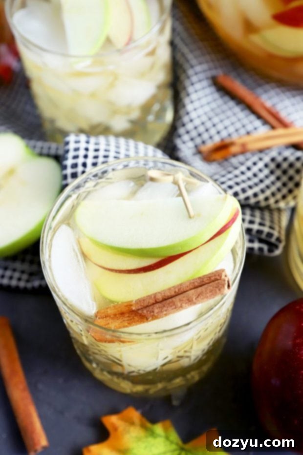 Effortless Apple Pie Sparkler 8 A beautifully garnished Thanksgiving cocktail, featuring sparkling apple pie sangria with cinnamon