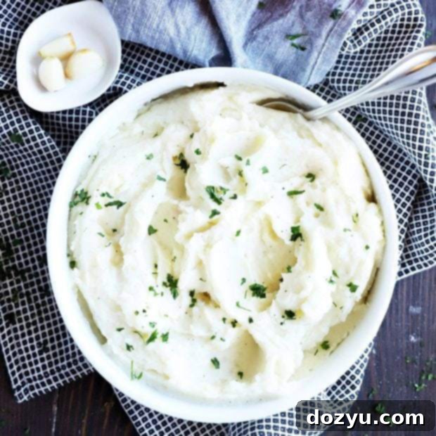 Roasted Garlic Parmesan Instant Pot Mashed Potatoes 10 Thumbnail of mashed potatoes in a bowl