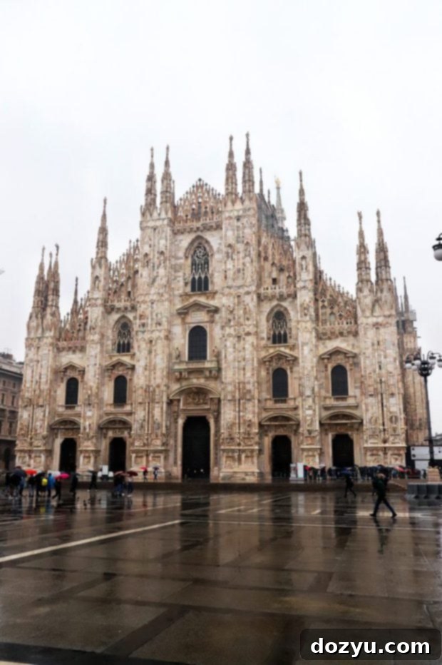 The impressive facade of Duomo di Milano from the main square