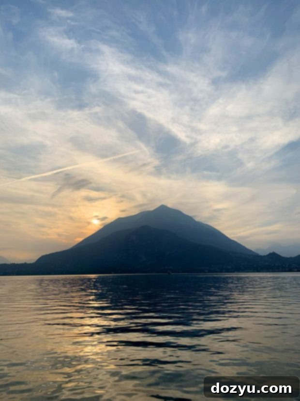 Stunning photo of Lake Como at sunset, with mountains and calm water