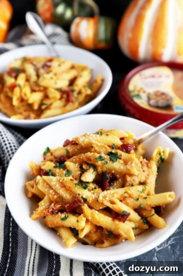 Garlic-Roasted Pumpkin Hummus Pasta 6 Easy fall pasta dish for Friendsgiving, served in a skillet.
