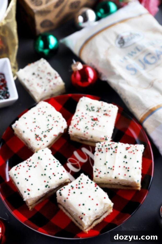 Spiced Snickerdoodle Eggnog Bars 6 Frosted chewy cookie bars on a festive plate, ready to be served