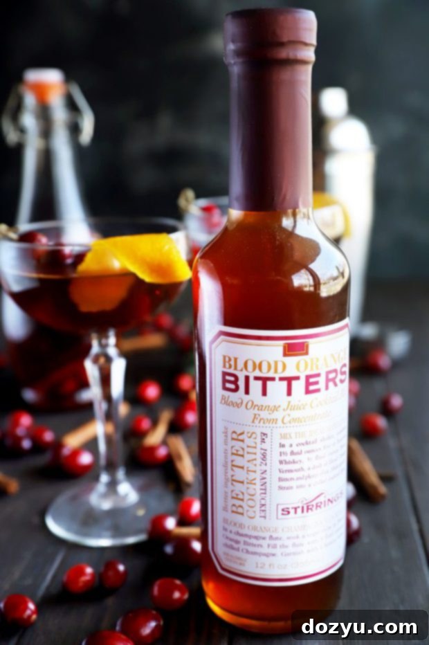Stirrings blood orange bitters in a bottle, a key ingredient for the Cranberry Spice Manhattan