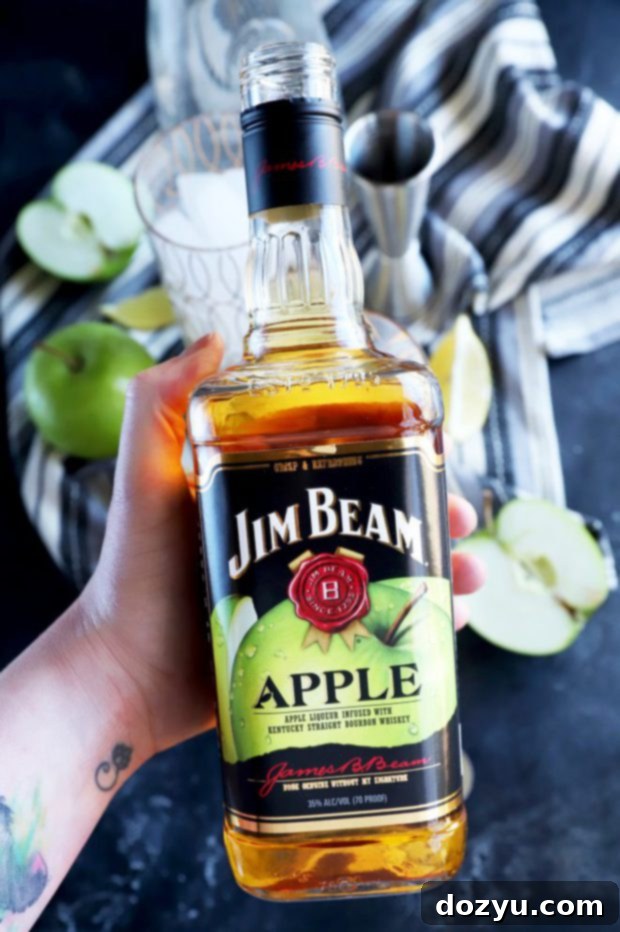 Jim Beam Apple Fizz 3 Photo of hand holding Jim Bean Apple bottle