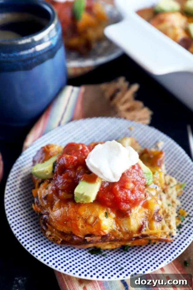 A beautifully plated slice of Mexican Biscuit Bake, showcasing the fluffy biscuits, egg, bacon, and cheese, ready for a delicious brunch.