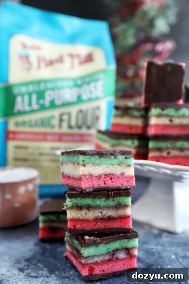 Rainbow Almond Delights 8 Close-up of a finished Italian Rainbow Cookie, showing the neat layers and chocolate coating