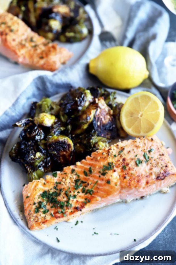 Zesty Lemon Garlic Salmon Bake 5 Salmon filet on a plate with brussels sprouts