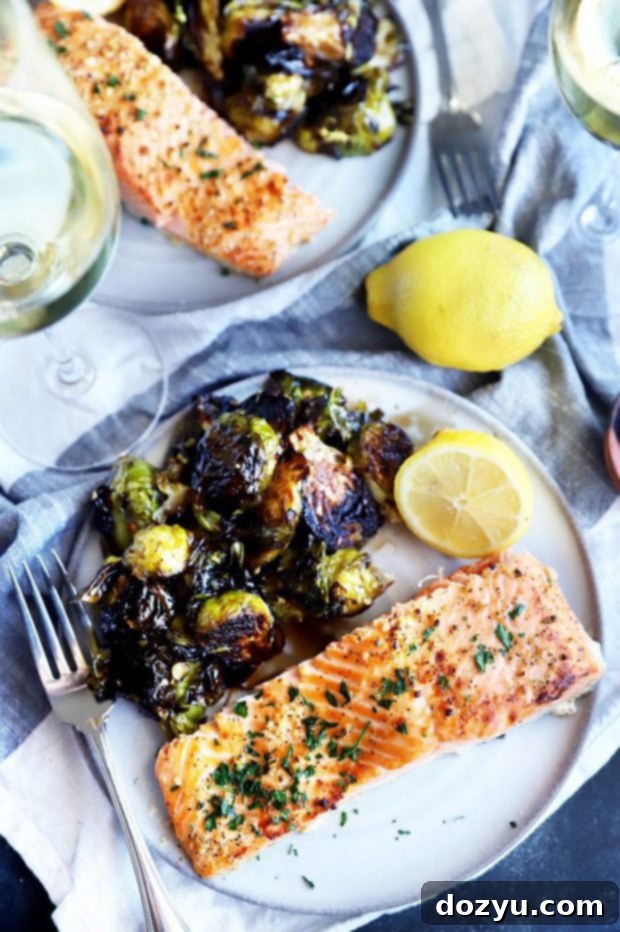 Zesty Lemon Garlic Salmon Bake 9 Salmon on a plate with sprouts image