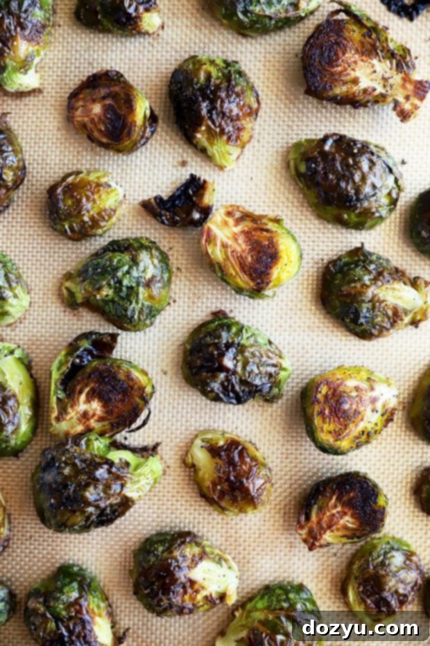 Zesty Balsamic Crispy Sprouts 6 Cooked brussels sprouts on a baking sheet