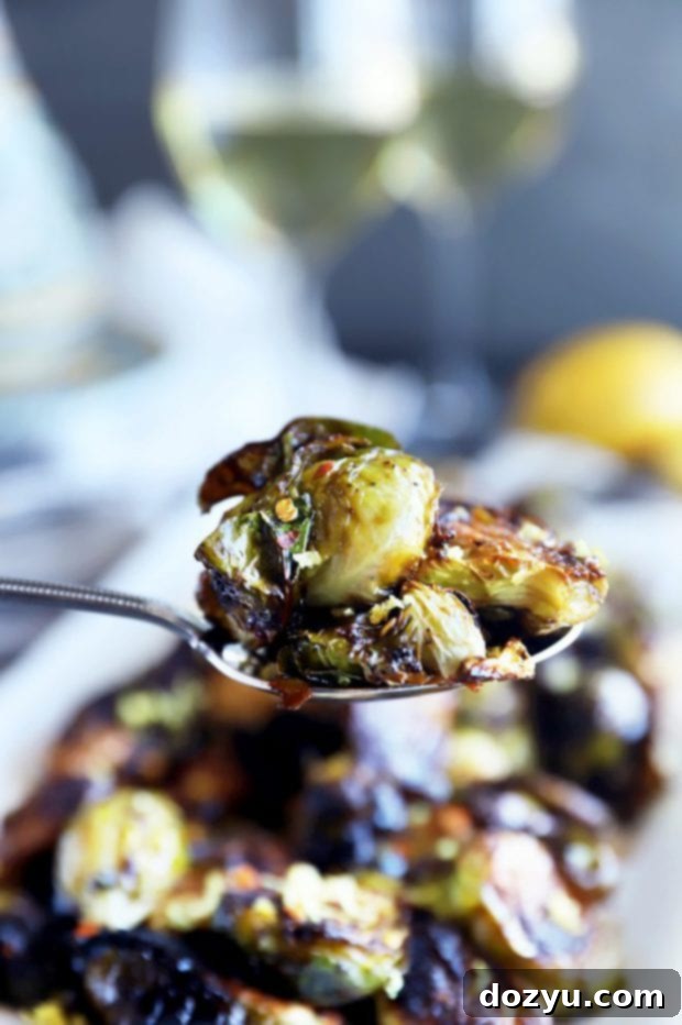 Zesty Balsamic Crispy Sprouts 9 Side photo of brussels sprouts on a spoon photo