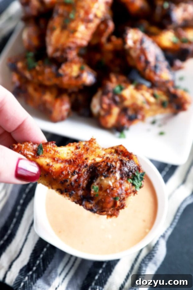 Smoky Dry-Rubbed Wings with Zesty BBQ Blue Cheese 7 Dipping a crispy dry rub wing into the tangy BBQ blue cheese sauce