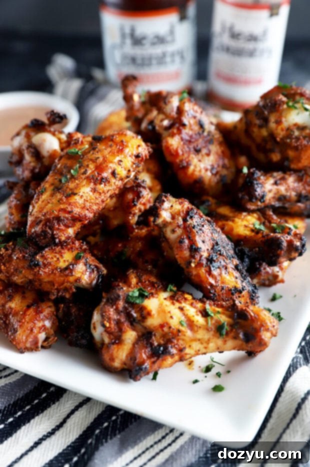 Smoky Dry-Rubbed Wings with Zesty BBQ Blue Cheese 8 Side view photo of dry rub chicken wings on a platter, showcasing crispy skin