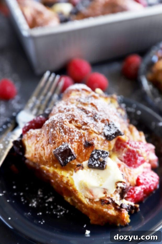Decadent Raspberry Chocolate Croissant French Toast Casserole 3 Slice of French toast bake on a plate photo
