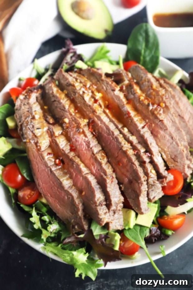 Umami Steak & Avocado Power Bowl 10 Big steak salad in a bowl photo, featuring perfectly cooked steak and fresh greens