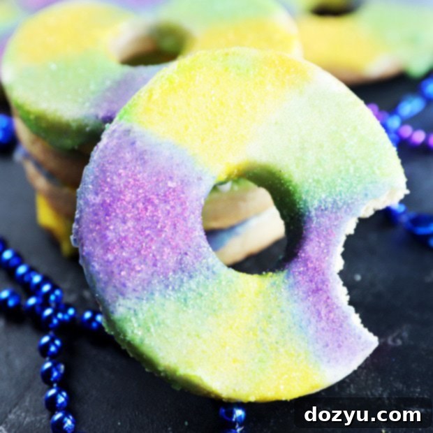Royal Carnival Cookies 10 Thumbnail image of a stack of King Cake Cookies with colorful sprinkles.