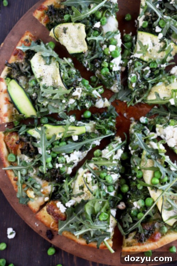 Garden Pesto Pizza 7 Picture of sliced pizza with greens