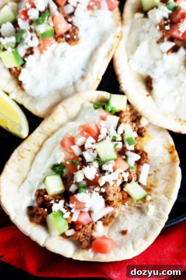 Savory Greek Beef Wraps 10 Overhead picture of Greek ground beef pitas, neatly arranged
