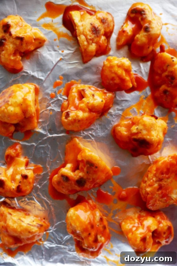 Golden Crispy Buffalo Cauliflower Wings 9 Crispy buffalo cauliflower on sheet pan picture