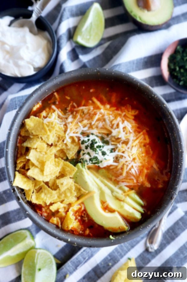 A vibrant, delicious bowl of Instant Pot Tortilla Soup viewed from above, showcasing its rich colors and toppings, ready for a comforting meal.