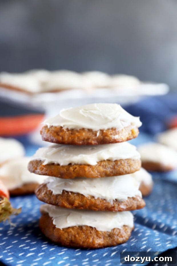 Spiced Carrot Cake Cookies 8 Stacked carrot cake cookies with cream cheese frosting