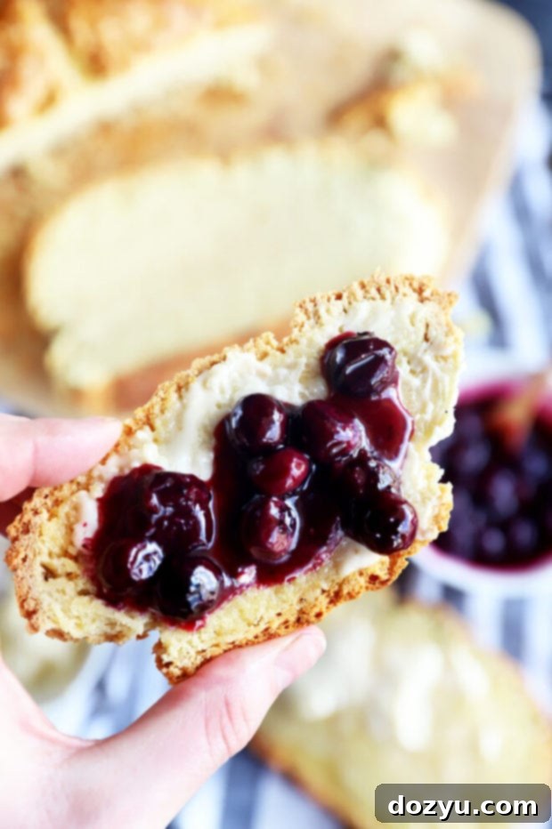 Easy No-Yeast White Bread 7 Hand holding slice of no yeast white bread