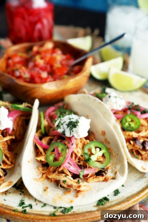 Speedy Instant Pot Chipotle Chicken Tacos 2 Chipotle chicken tacos with vibrant pickled red onions and fresh cilantro