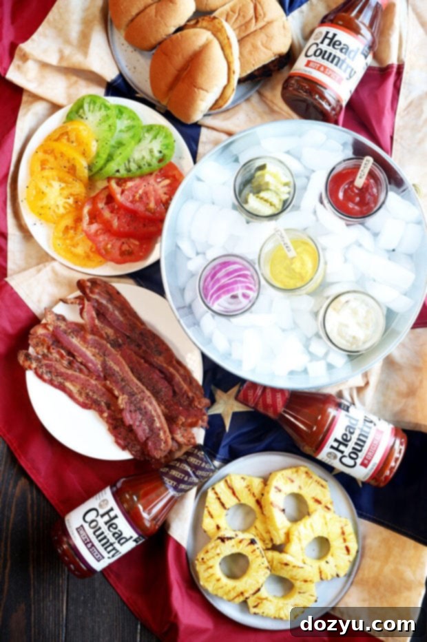 Craft Your Ultimate Gourmet BBQ Burger Bar 2 Gourmet BBQ Burger Bar Overhead Image - A vibrant spread of burgers and toppings ready for customization.