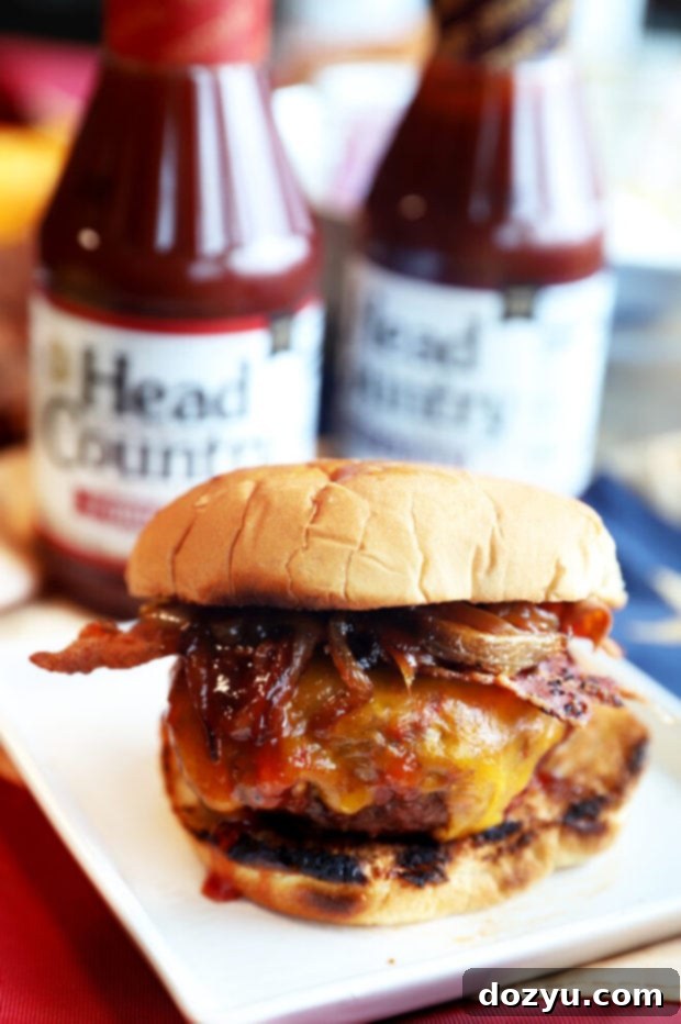 Craft Your Ultimate Gourmet BBQ Burger Bar 6 A delicious Bacon Cheddar BBQ Burger with melted cheese, bacon, and caramelized onions.