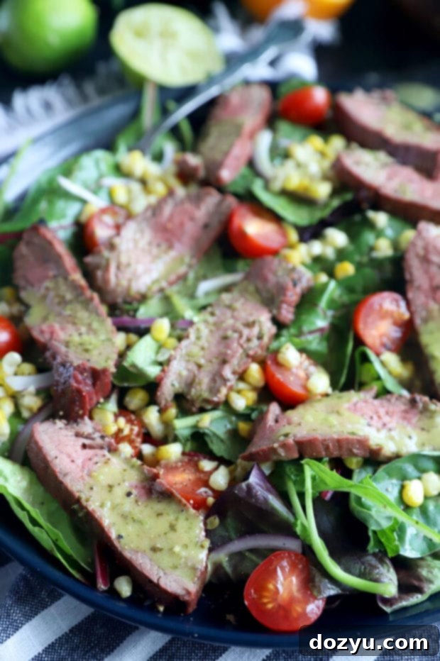 Mojo steak salad on a plate photo, showcasing tender beef and fresh ingredients