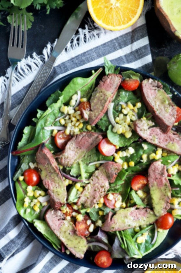 Summer salad overhead picture with corn, steak, and fresh veggies