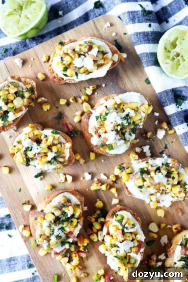 Zesty Grilled Elote Crostini 2 Delicious Grilled Mexican Street Corn Crostini stacked on a plate